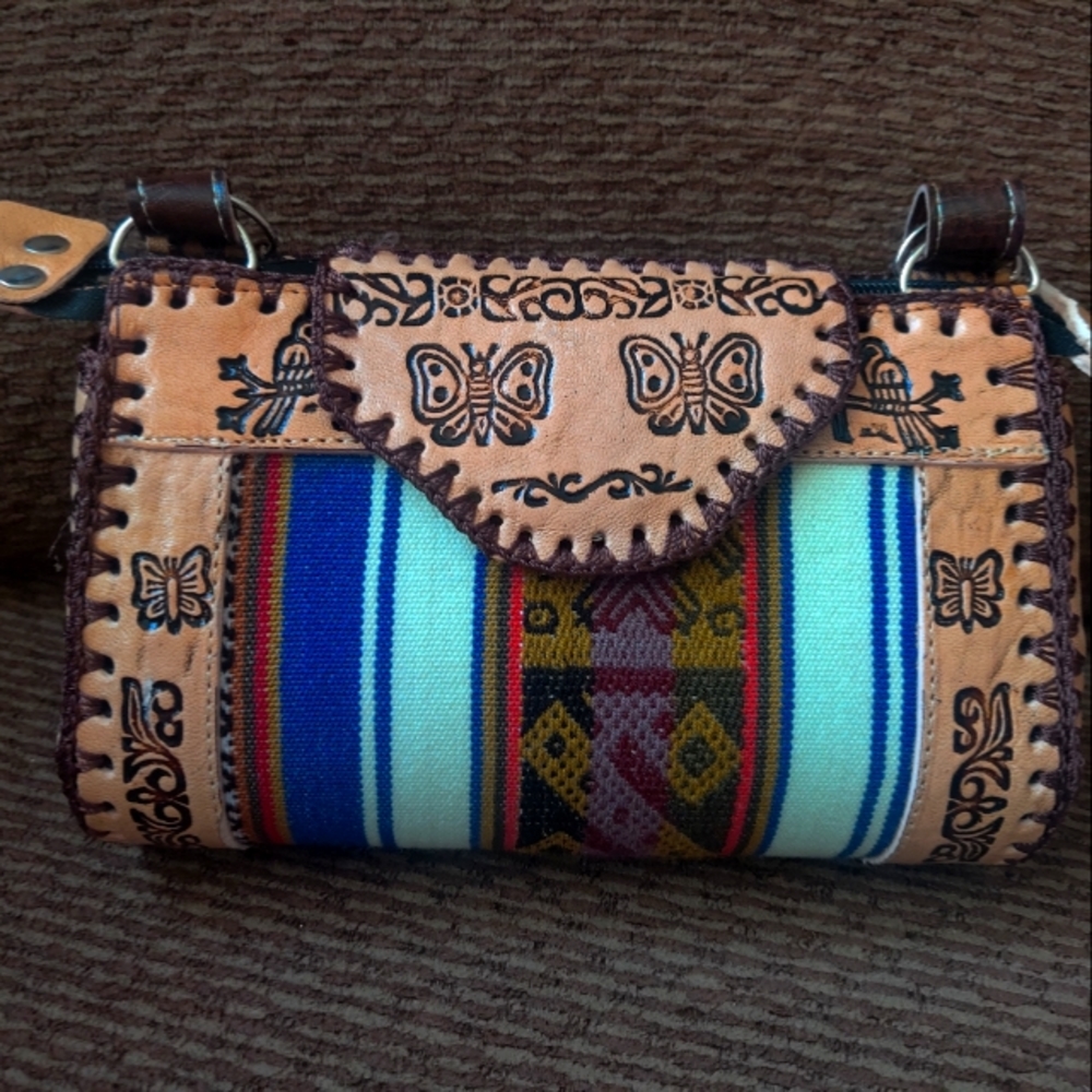 100 % Leather Assembled and made in Peru.Beautiful butterfly and Tribal design